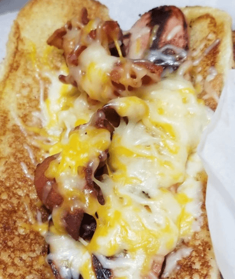 Hot Pig Dog sandwich close-up with toppings