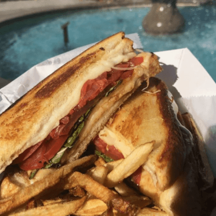 Margherita grilled cheese with fresh mozzarella, tomato, and basil